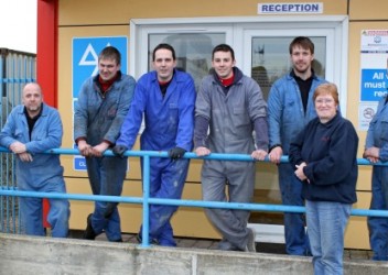 The P&L Motors team outside their new home