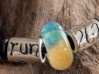 Charming Rewards bracelet with glass bead, and ‘run 26.2’ silver charms