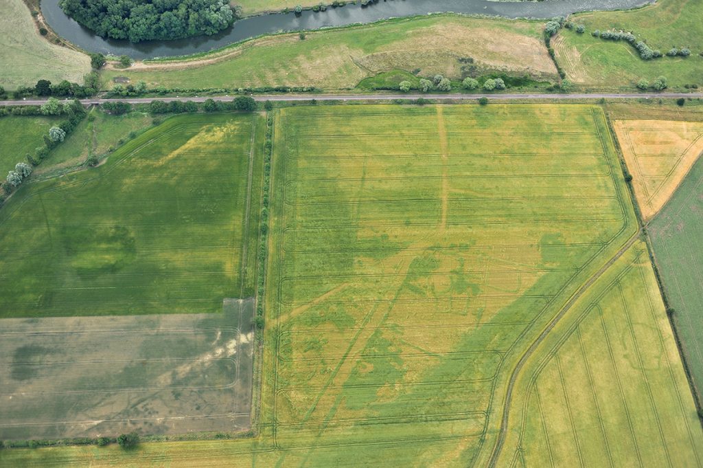 Looking across Normangate Field at Castor towards the river Nene (top) and the Nene valley railway