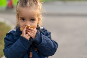 Girl eating outside