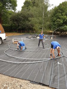 Volunteers at work assembling the polytunnel for the new Nene Nursery