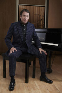 Jools Holland sitting at the piano - photo by Mary McCartney