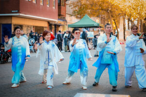 Photo taken by Chinese Community in Peterborough Volunteer Photographer Shirley Zhang, promoting tai chi for wellbeing in front of Town Hall to wider diverse communities